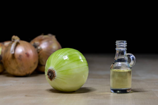 istock Onion the best specific  for influenza. Syrup prepared from onions. Black background. 924686278