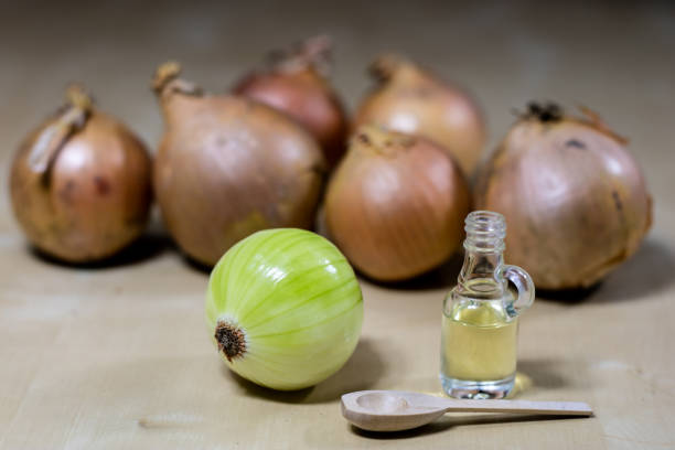 istock Onion the best specific  for influenza. Syrup prepared from onions. Black background. 924686292