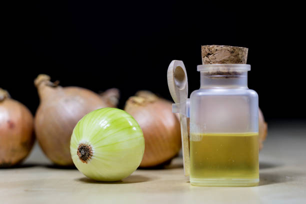 Onion the best specific  for influenza. Syrup prepared from onions. Black background.