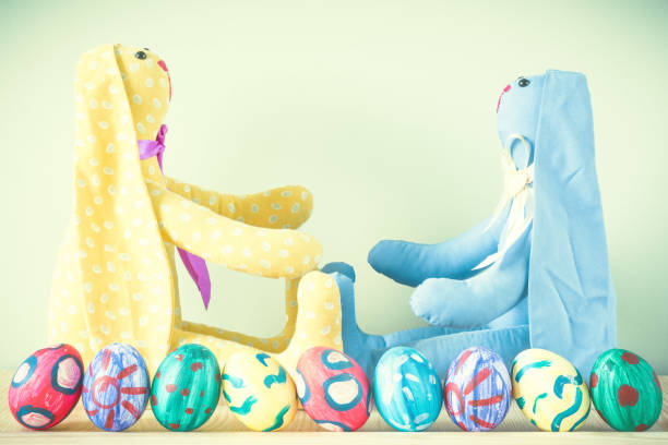 istock Easter bunnies on a green background 924689040