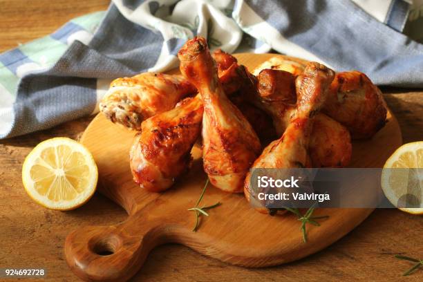 Grilled Chicken Legs On Cutting Boardrustic Dinner Background Stock Photo - Download Image Now