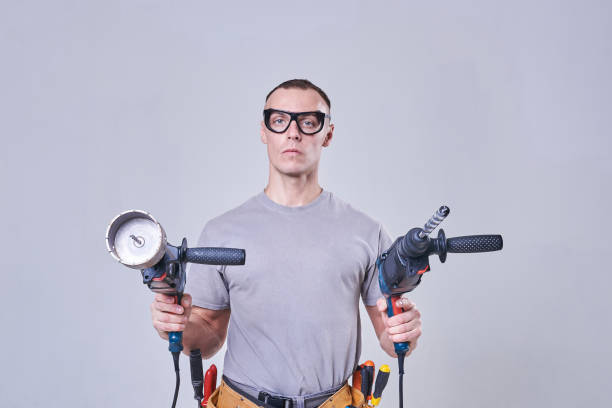 istock Master-Builder-finisher in their working clothes, with two hammers in his hands 924693600