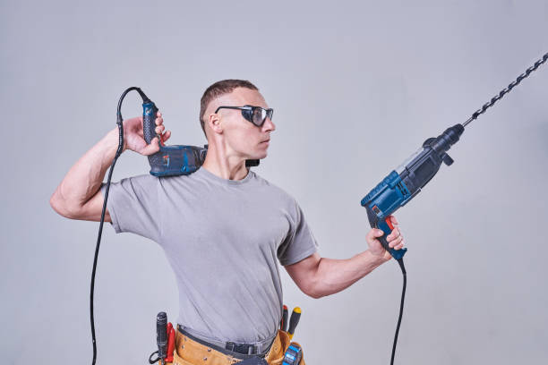 istock Master-Builder-finisher in their working clothes, with two hammers in his hands 924693608