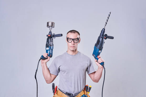 istock Master-Builder-finisher in their working clothes, with two hammers in his hands 924693898