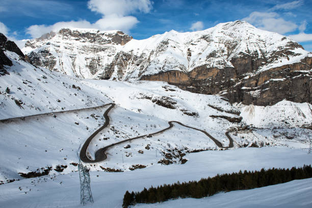 istock snowy Pyrenees mountains with a small winding road 924694328