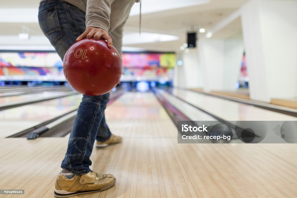 Man about to throw bowling ball An unrecognizable man is about to throw a bowling ball. Ten Pin Bowling Stock Photo