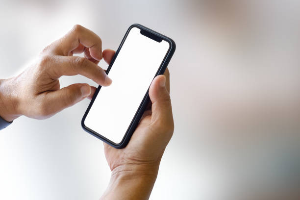 istock Man using smartphone, Mobile phone showing blank screen for graphic display montage. 924698804