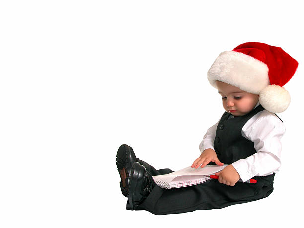 Adorable Baby Boy in Suit Making His Chirstmas List  inkpen stock pictures, royalty-free photos & images