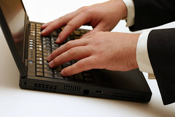 um laptop digitando - shirt and tie typing communication part of - fotografias e filmes do acervo
