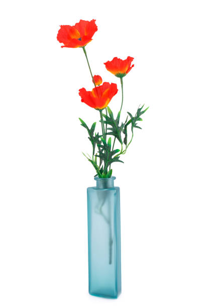 red poppies in blue glass vase - plastic poppy imagens e fotografias de stock