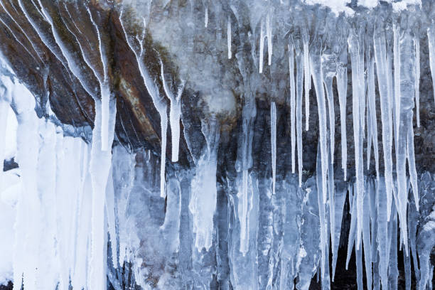istock Row of frosty icicles in nature 924705948