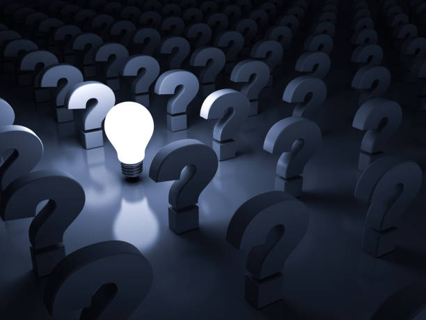 istock One glowing idea light bulb shining among the question marks on dark blue background , individuality and different concepts 924709476
