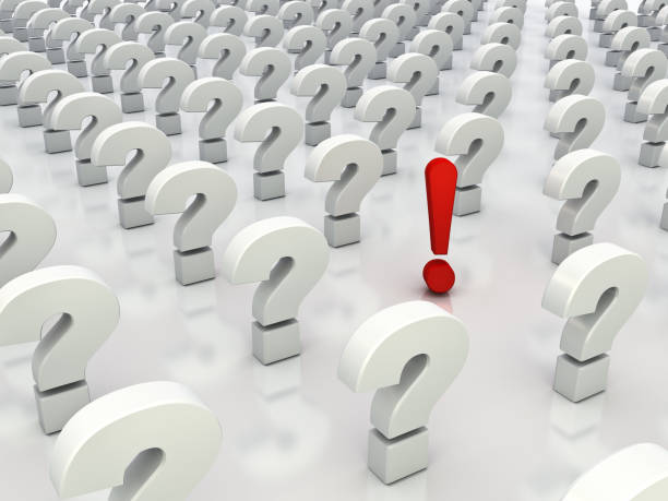 istock One red exclamation mark standing out from white question marks on white background with reflection 924709482