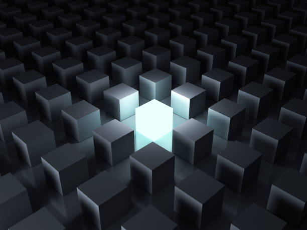 istock One glowing light cube shining among other dim cubes in the dark night background with reflections and shadows 924709726