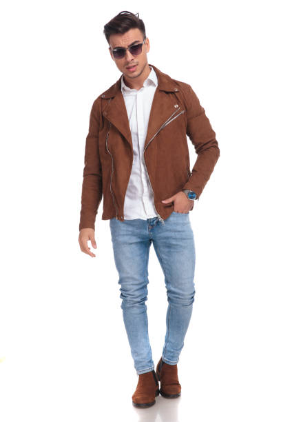 istock serious fashion man in leather jacket posing 924710854