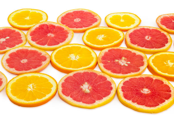 istock Round slices of oranges and red grapefruits on white background 924715876