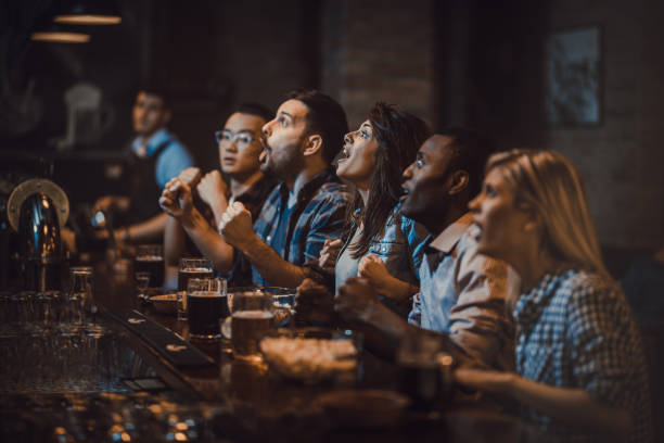 istock Watching a sports match on a TV in a bar! 924717462