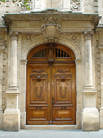 old solid wood door of a Bordeaux house in Aquitaine
