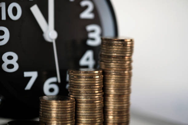 istock Step of coins stacks and alarm clock with tablet computer and financial graph, business planning vision and finance analysis concept. 924720414