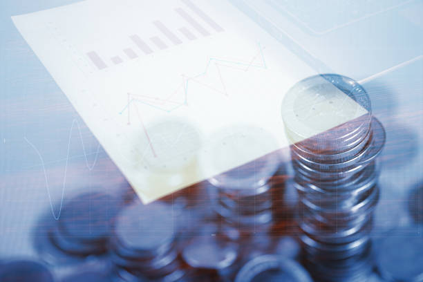 istock Double exposure of coin stack and notebook laptop computer with financial graph on white paper business planning vision and finance analysis concept. 924720458