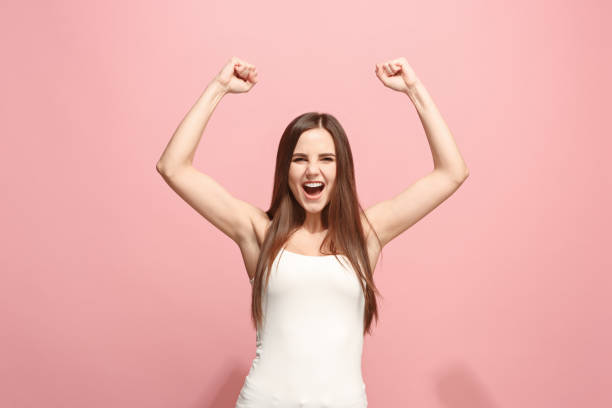 istock Winning success woman happy ecstatic celebrating being a winner. Dynamic energetic image of female model 924721064