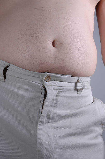 nu homme en surpoids ventre - pot belly greed overweight excess photos et images de collection