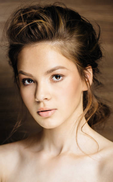 istock woman with wave hair and professional make up 924723596