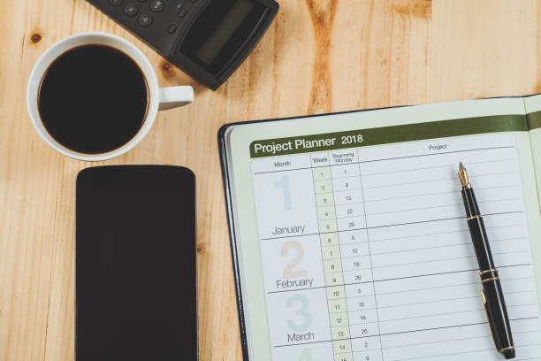 istock personal project planner with fountain pen and hot coffee on wood table. 924723794