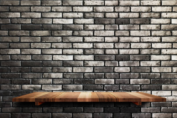 istock Empty wood board shelf at black brick wall background,Mock up for display or montage of product or design 924724524