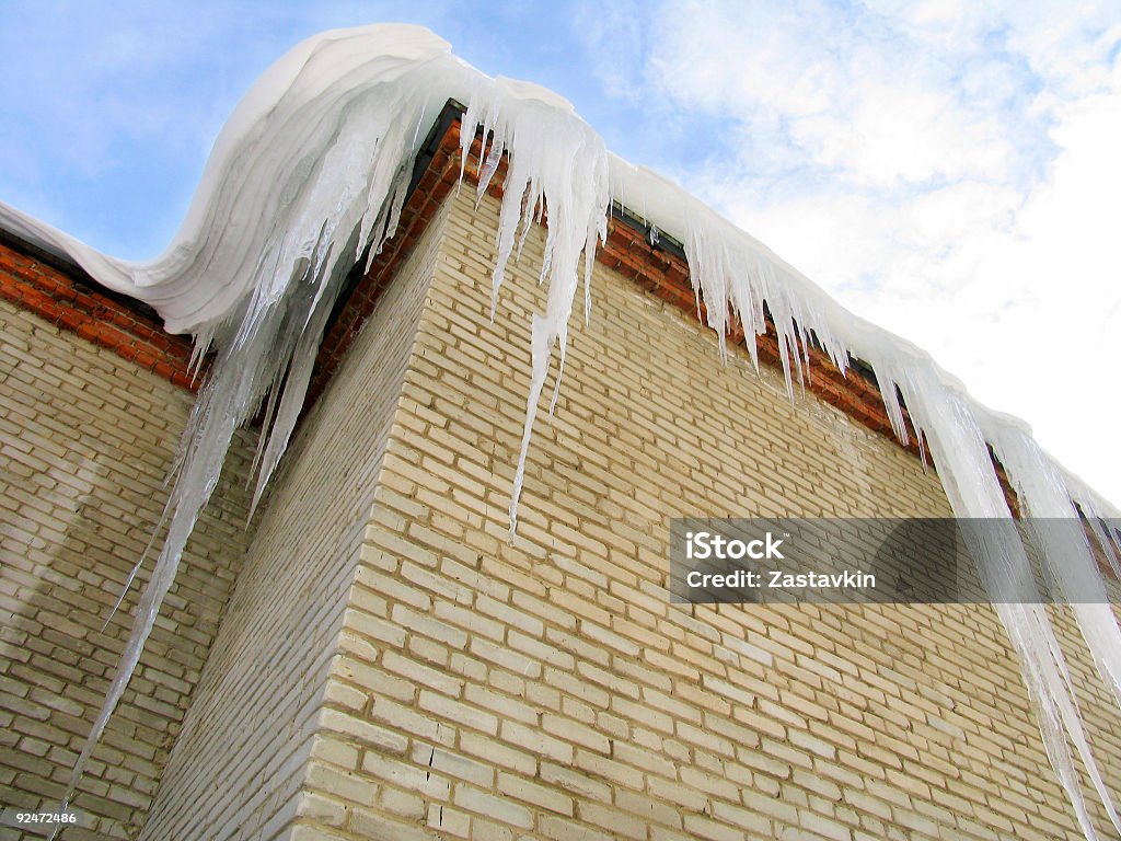 Icicles on the roof  Blue Stock Photo