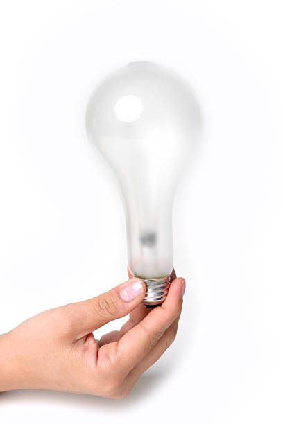 Holding Lightbulb stock photo