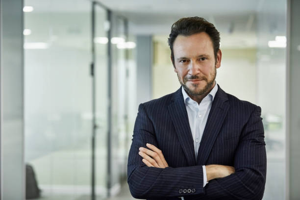 istock Confident entrepreneur standing with arms crossed 924727010