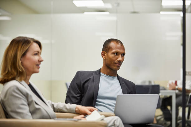 istock Confident business colleagues sitting at lobby 924727046
