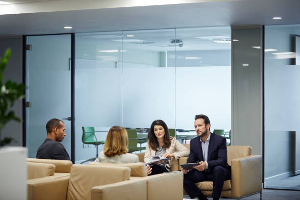 istock Business colleagues discussing against board room 924727072