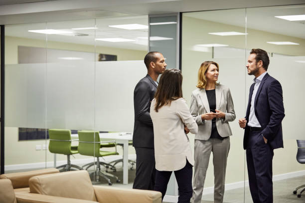 istock Colleagues planning strategy against board room 924727124