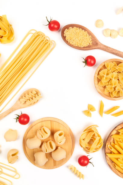 istock Overhead photo of different types of pasta on white, forming frame 924728416