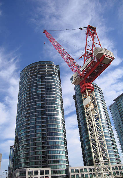 A crane appears to be lifting a huge building.