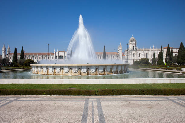 Fountain in Garden Praca do Imperio and Jeronimos Monastery in Lisbon, Portugal, Belem District.