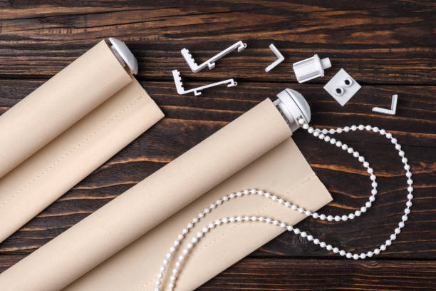 istock The beige rolled blind is on a wooden surface. 924749262
