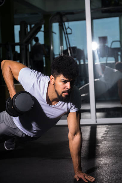 istock Dumbbell push up individual training at gym 924752850