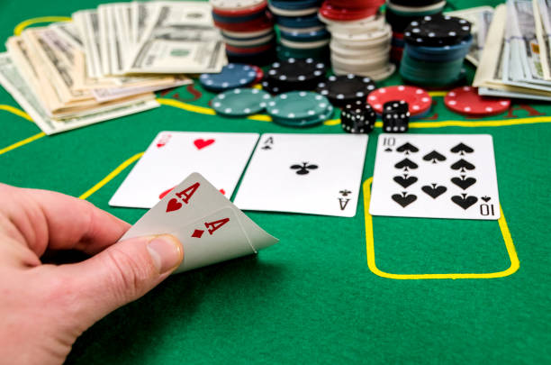 istock Aces in the player's hand on the poker table 924753902