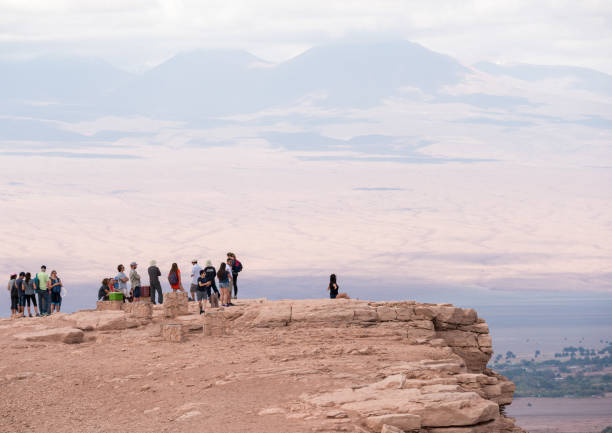 istock Tourists in Atacama desert - Moon valley mountains, sunset 924759488