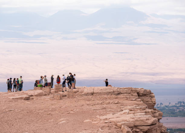 istock Tourists in Atacama desert - Moon valley mountains, sunset 924759628