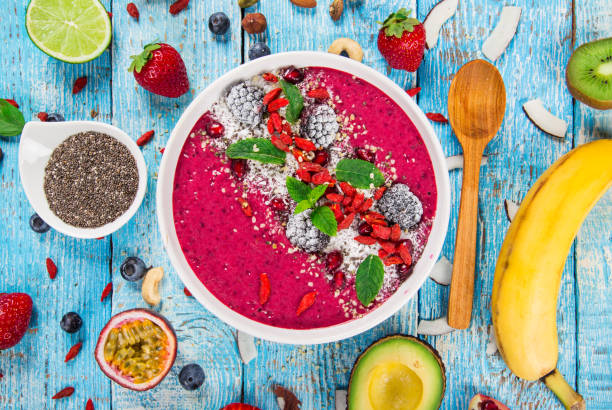 istock Smoothie bowl with fresh berries, nuts, seeds, fruit and vegetables 924759898