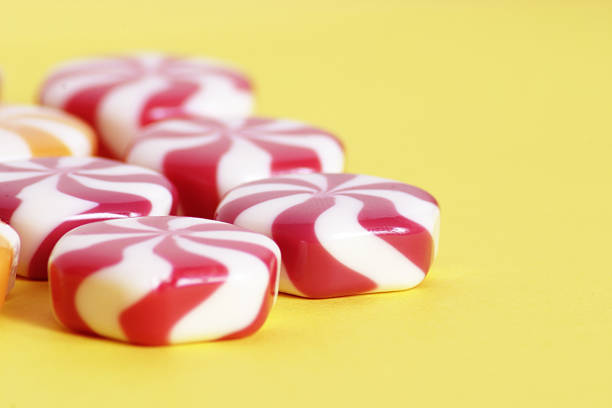 candy on a yellow background stock photo