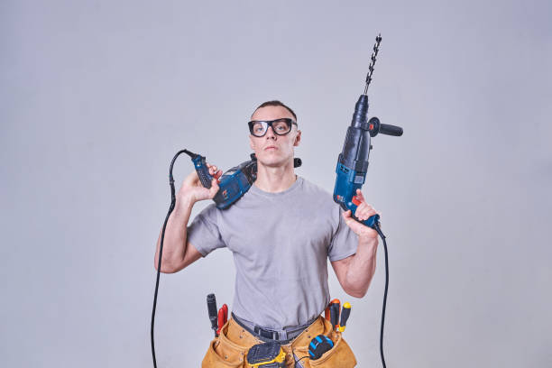 istock Master-Builder-finisher in their working clothes, with two hammers in his hands 924767208
