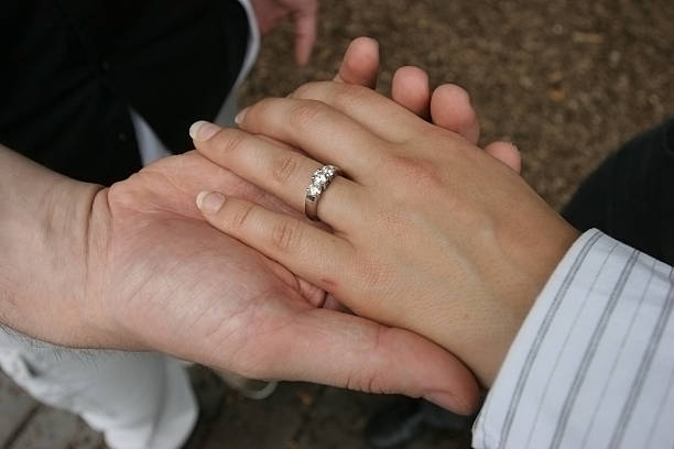 istock Woman's hand on top of man's 92476971