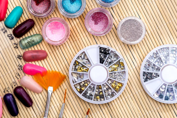 istock different colors of varnish, sparkles, crystals for nails 924772344