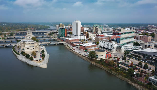 Cedar Rapids Aerial Skyline View With River Downtown Cedar Rapids aerial skyline view with Cedar River and Mays Island on the left. iowa stock pictures, royalty-free photos & images