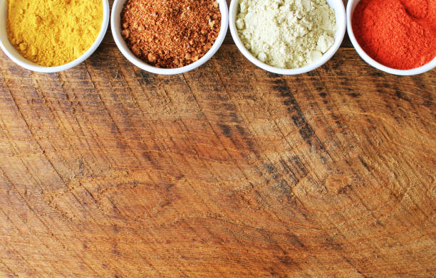 istock Various colorful spices on wooden table. Top view 924779120